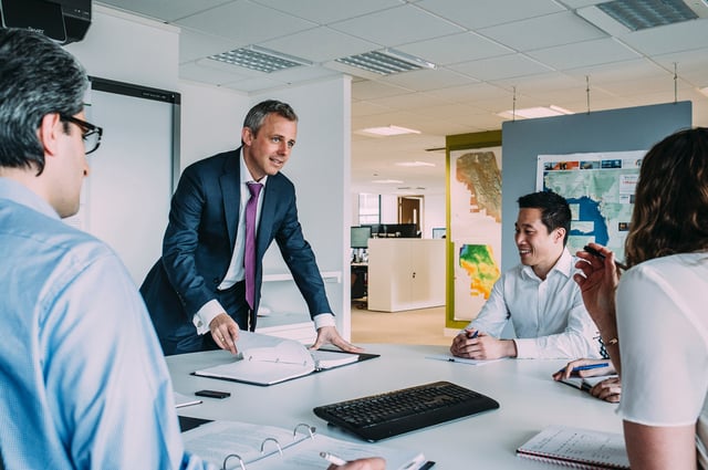 An executive is enjoying sharing what he learned from training and development An executive is enjoying sharing what he learned from training and development